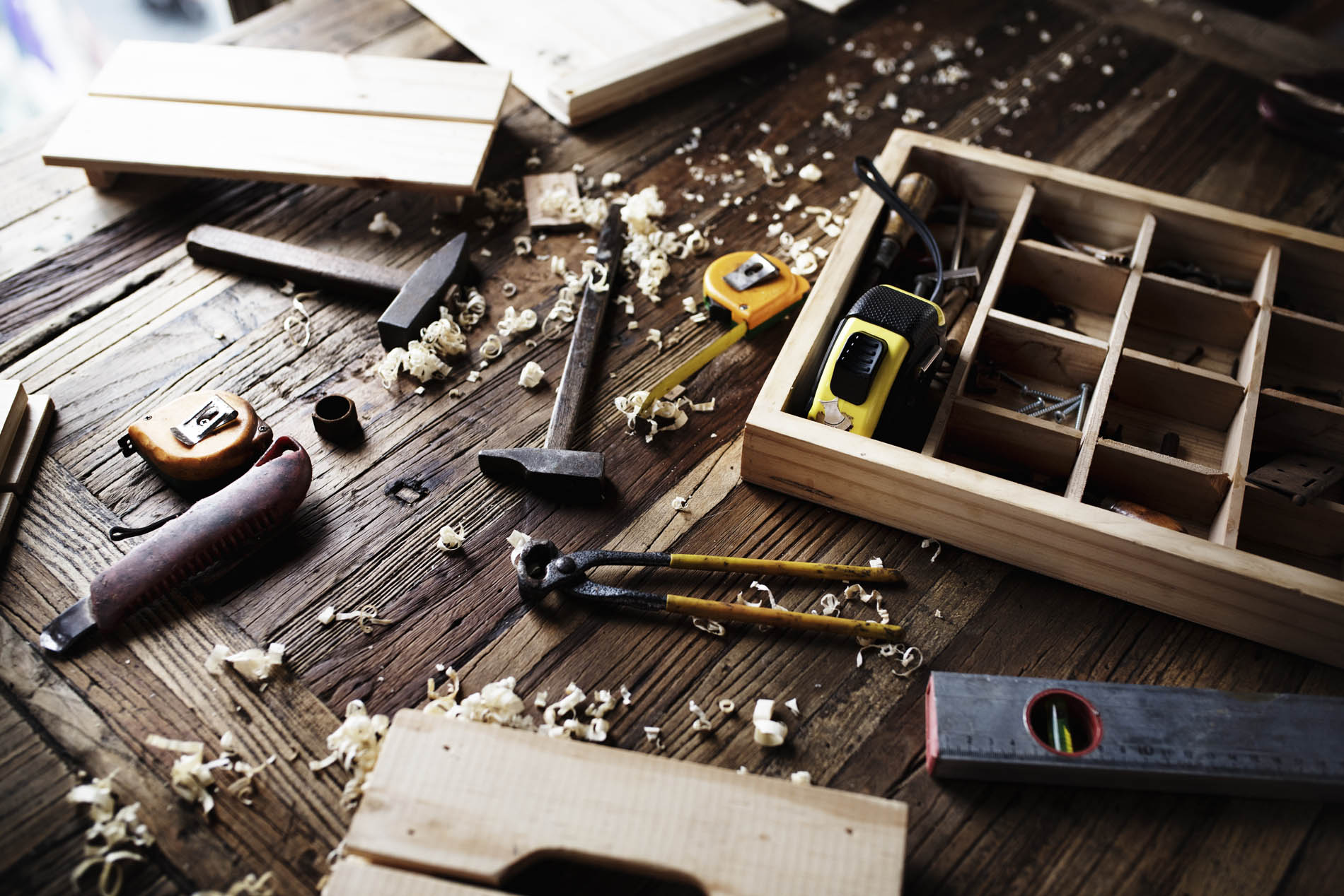 Aerial view of carpenter tools equipment set on wooden table